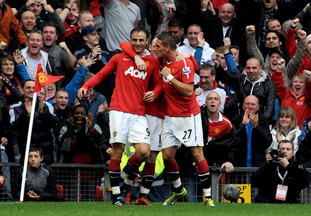 Manchester United's Dimitar Berbatov (left) celebrates after completing his hat-trick in a 3-2 win over Liverpool at Old Trafford in 2010-11