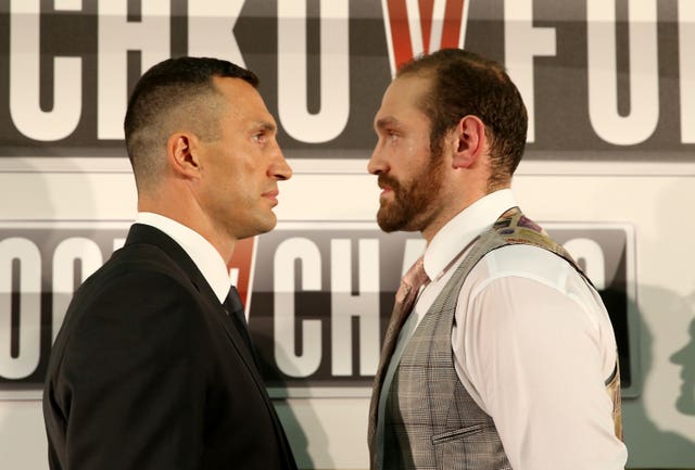 Wladimir Klitschko, left, Tyson Fury face off