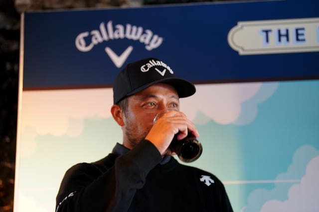 Xander Schauffele drinks a pint of Guinness