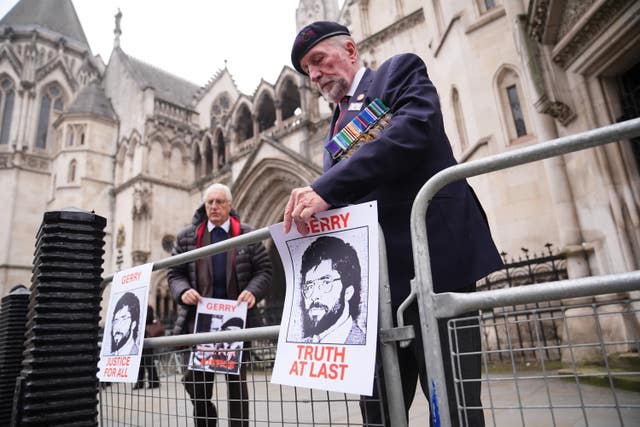 British military veterans hanging placards outside the Old Bailey