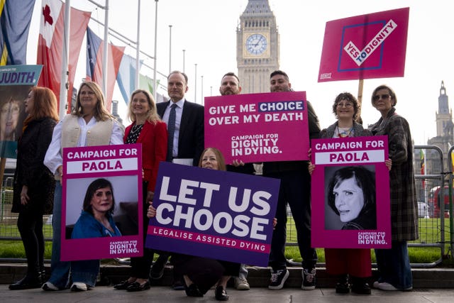 MP Kim Leadbeater with supporters of the Terminally Ill Adults (End of Life Bill) holding placards outside Parliament