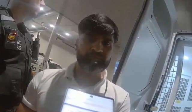 Screen grab from bodycam footage of the arrest of Urfan Sharif at Gatwick Airport