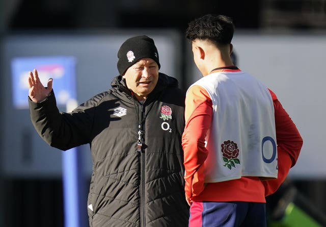 Eddie Jones (left) has been criticised for replacing Marcus Smith (right) at Murrayfield