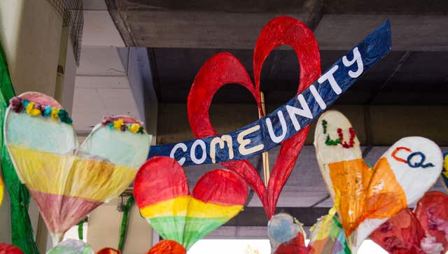 Painted hearts hang near Grenfell Tower (Dominic Lipinski/PA)