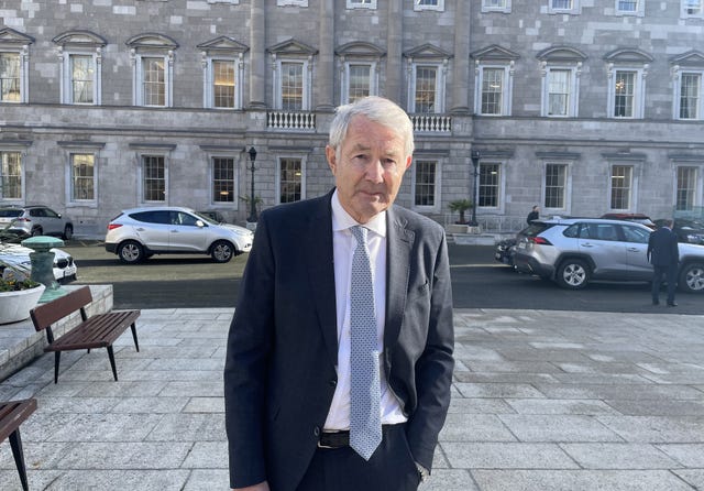 Tipperary TD Michael Lowry speaking to media outside Leinster House in Dublin, following the resolution of a row over Dail speaking time 