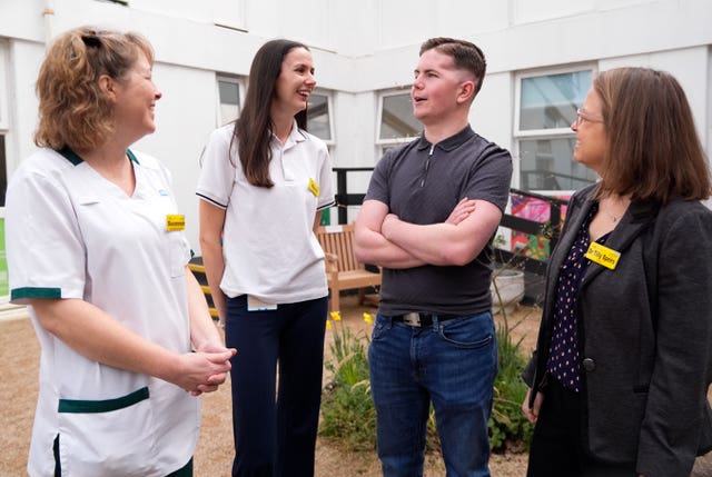 Dan Hurst chats with, from left, Susannah Bailie, clinical specialist occupational therapist;  senior stroke physiotherapist Olivia Sheppard and Dr Tilly Speirs, consultant stroke physician at Frimley Health NHS Foundation Trust who helped his recovery 