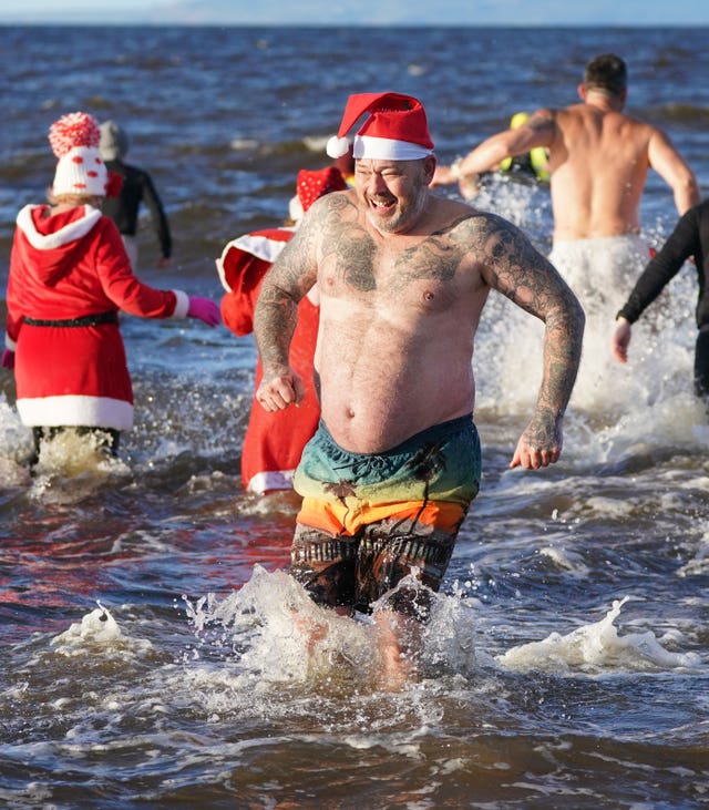 Swimmers take part in the Ayrshire Cancer Support Boxing Day Dip at Ayr Beach 