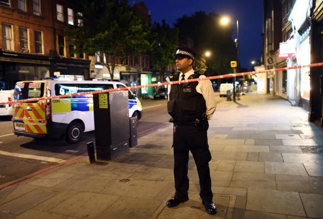 A police officer at the scene on Upper Street (Victoria Jones/PA)