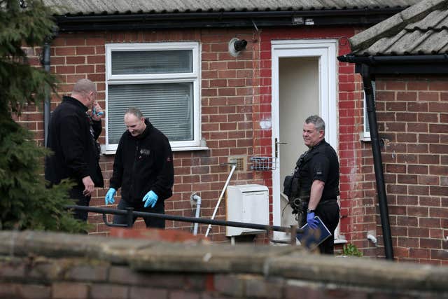 Police activity outside an address in Savile Town (Aaron Chown/PA)