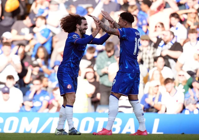 Marc Cucurella celebrates scoring Chelsea's goal with Jadon Sancho 