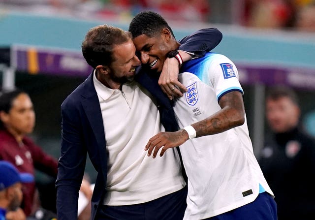 Marcus Rashford gets a hug from manager Gareth Southgate