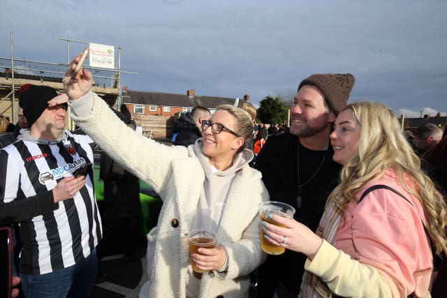 Brian McFadden takes a picture with Chorley fans
