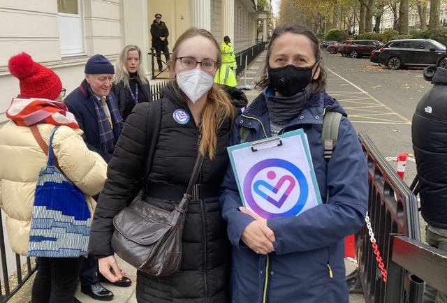 Two women standing outside a building in London