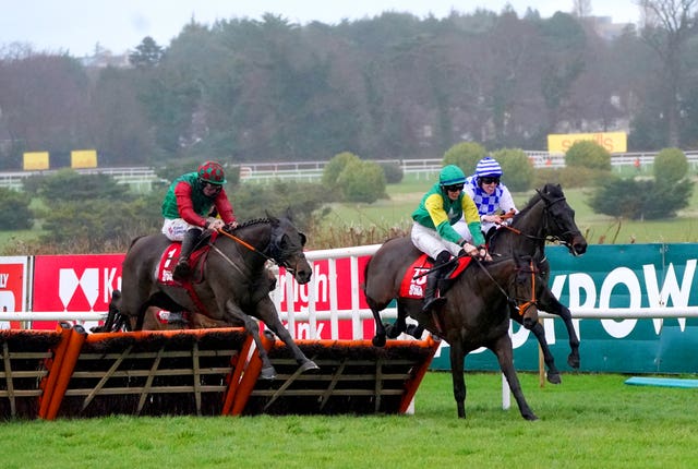 Sam’s Choice and Jack Kennedy (left) jump the final flight at Leopardstown 