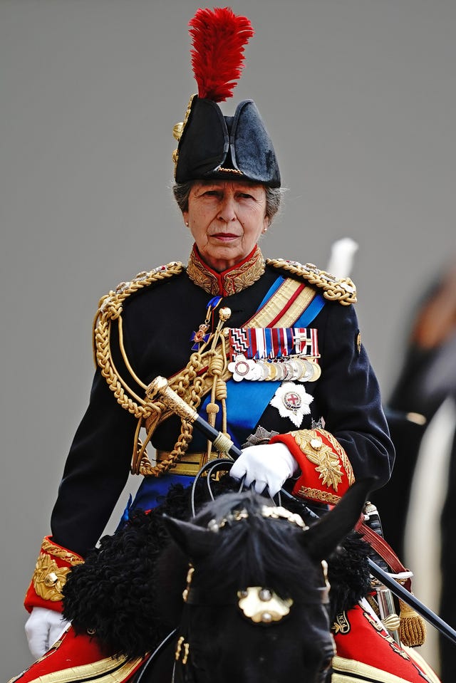 Anne in military uniform sat on a horse at Trooping the Colour