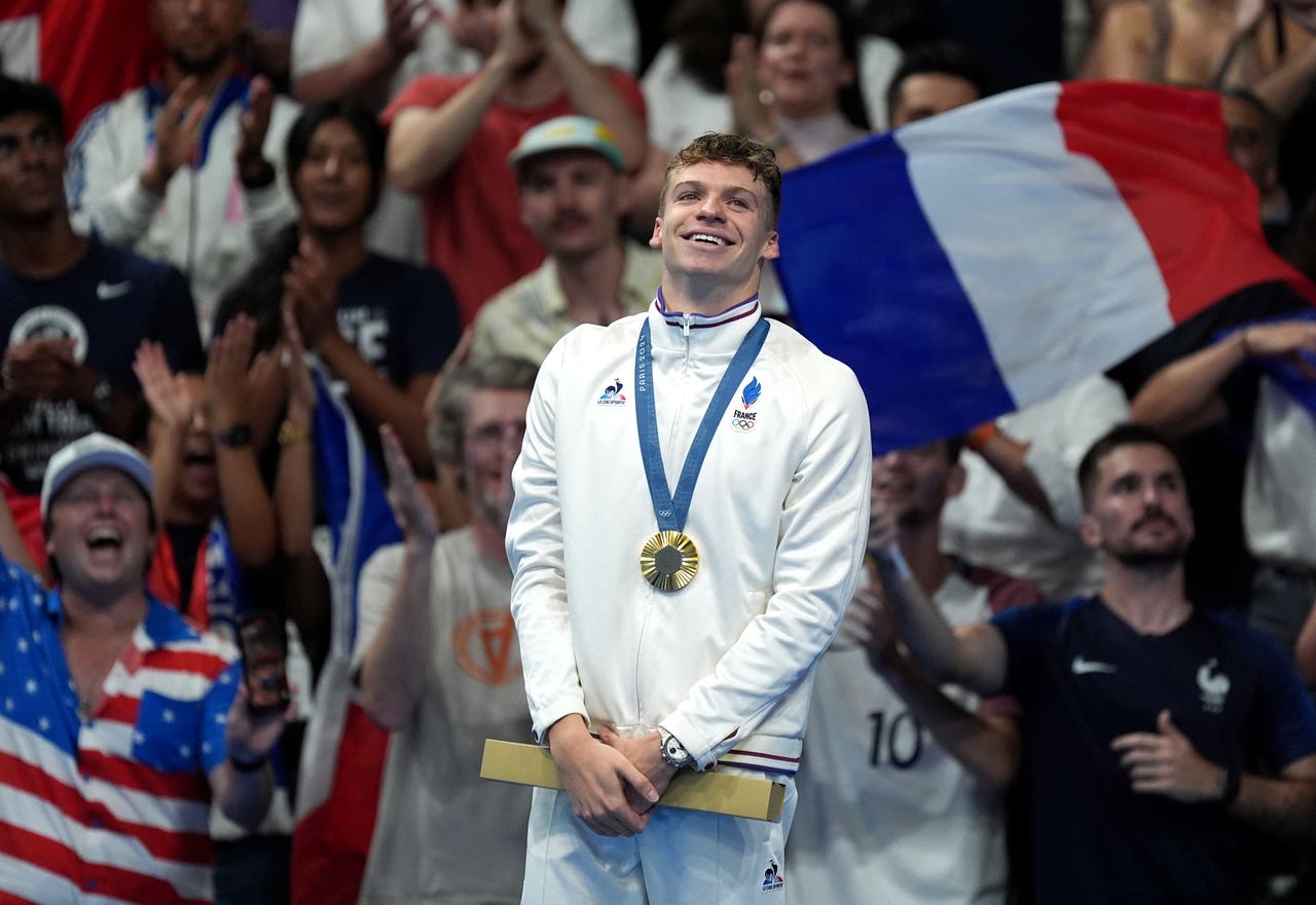 Leon Marchand is toast of Paris with astonishing Olympic double in the