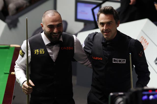 Ronnie O’Sullivan and Hossein Vafaei after their match at the World Snooker Championship