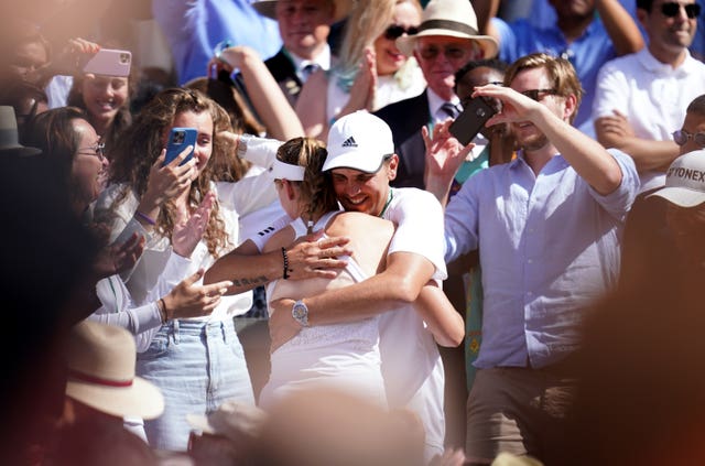 Elena Rybakina is embraced by coach Stefano Vukov after winning the Wimbledon title in 2022