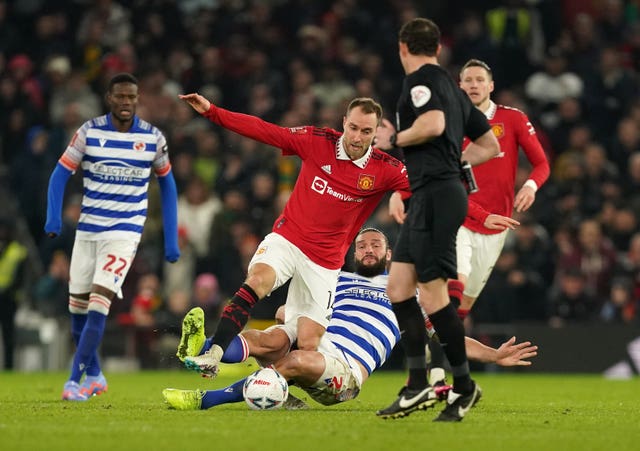 Christian Eriksen, left, is fouled by Reading’s Andy Carroll