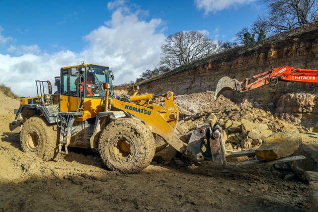 After being blessed the stone was lifted onto a truck by a digger and transported to Salisbury (Steve Parsons/PA).