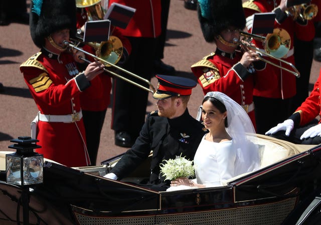 The Duke and Duchess of Sussex on their wedding day. Angela Merkel said she enjoyed the royal wedding (Andrew Milligan/PA)