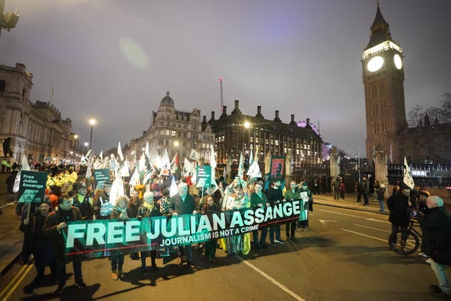 Campaigners pressing for the release of Assange take part in a demonstration during a Night Carnival in Parliament Square
