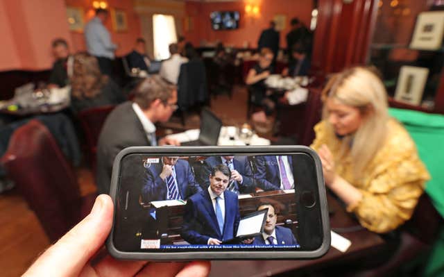 Journalists and lobbyists take notes as Paschal Donohoe delivers his Budget