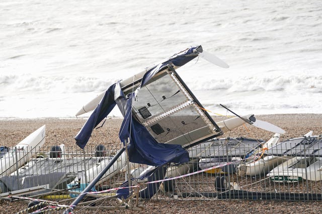 A catamaran washed up along the seafront in Brighton