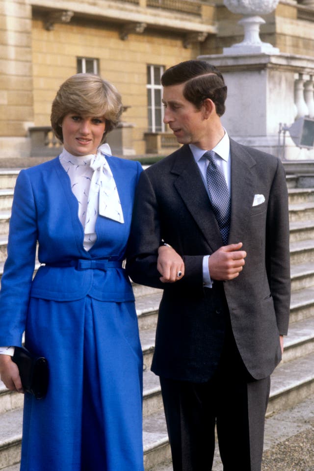 Prince Charles and Lady Diana Spencer (wearing the diamond and sapphire engagement ring he gave her) looking affectionate in the grounds of Buckingham Palace after the announcement of their engagement in London on Feb. 24, 1981.