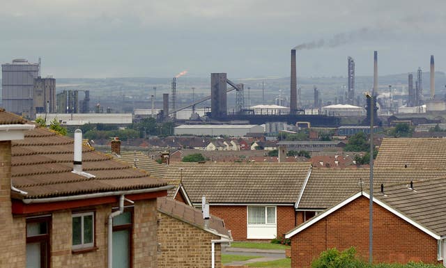 Roofs of houses with industrial premises in background