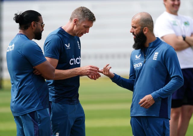 Moeen Ali's injured finger receives attention at Lord's.