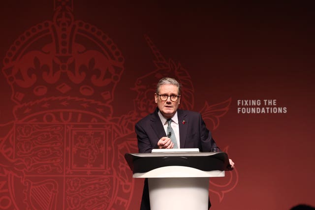 Sir Keir Starmer giving a speech behind a podium