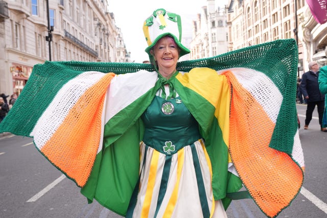 A woman dressed in orgen and green 