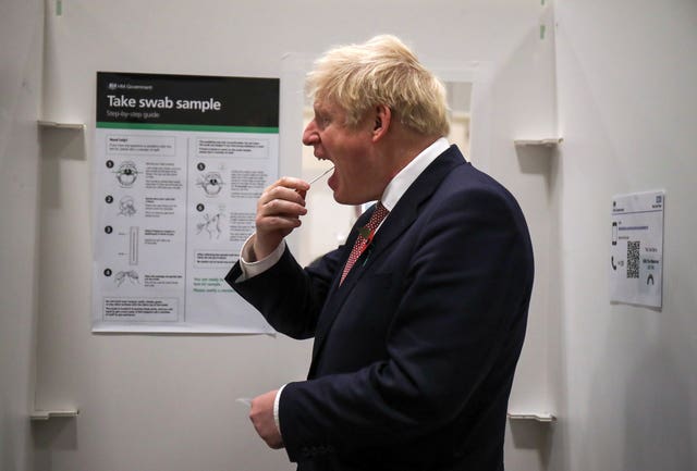 Prime Minister Boris Johnson takes a coronavirus test at a testing centre in De Montfort University in Leicester
