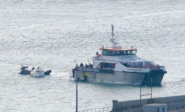 A Border Force vessel tows a yacht in to Dover