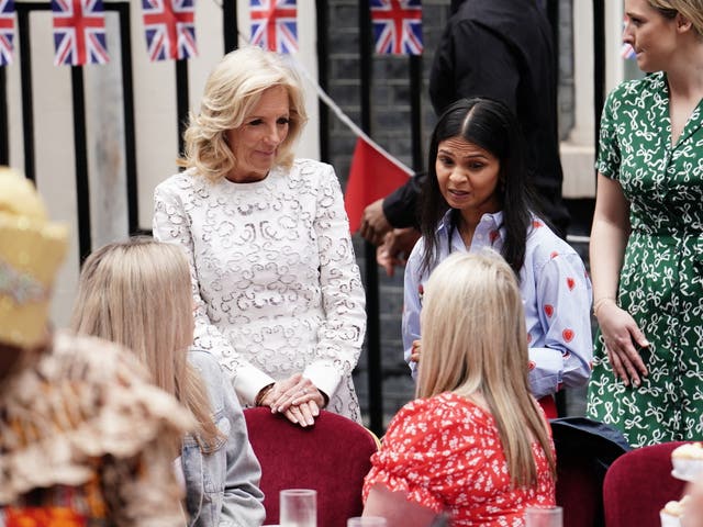 Jill Biden (left) and Akshata Murty (right) talk with guests