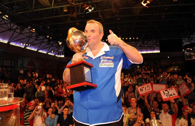 Phil Taylor celebrates his 2010 World Championship win