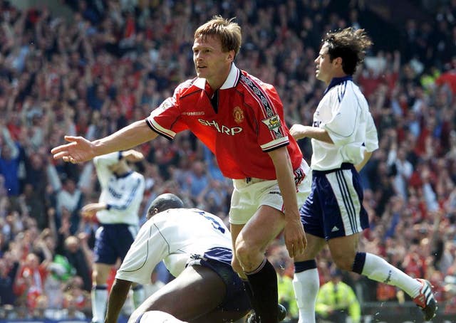 United forward Teddy Sheringham (centre) celebrates scoring.