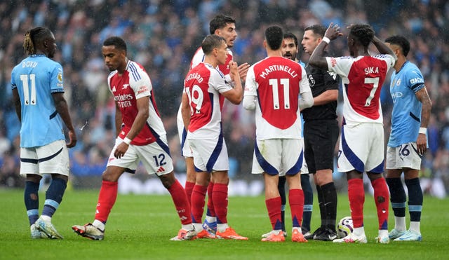 Leandro Trossard shown a red card by referee Michael Oliver