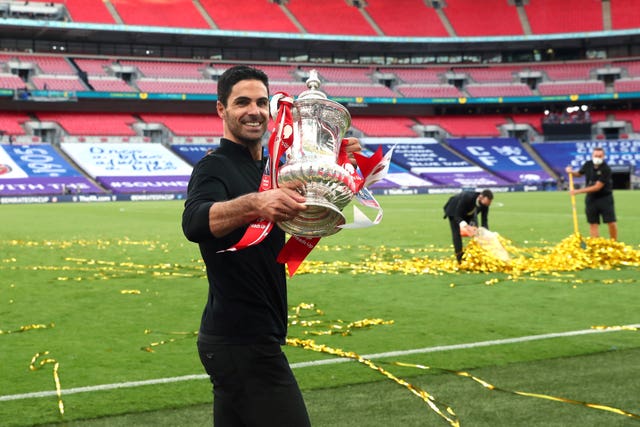 Arsenal boss Mikel Arteta holds the FA Cup after Arsenal's victory in 2020