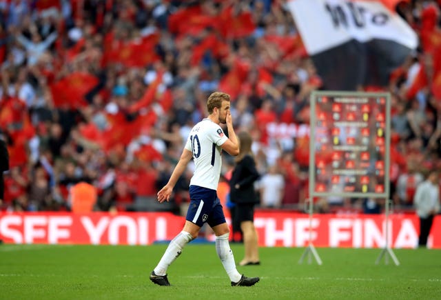 Harry Kane appears dejected as he leaves the field following Spurs' semi-final defeat