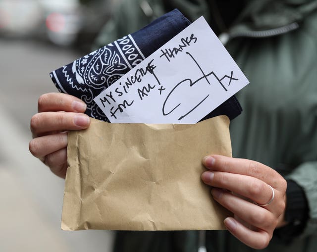 A brown envelope containing a bandana and a handwritten note from actor Johnny Depp was given to supporters at the High Court in London