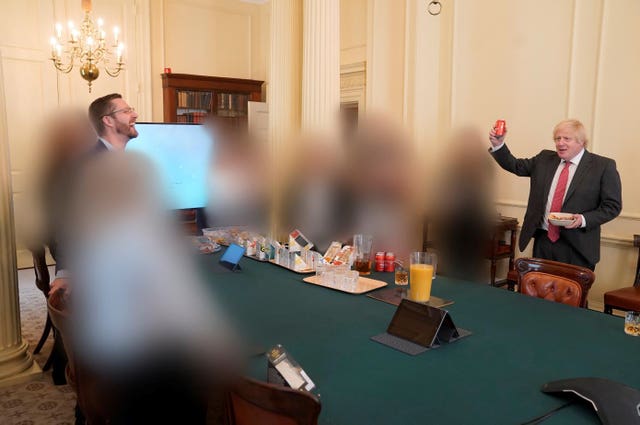 A photo showing Prime Minister Boris Johnson, right, at a gathering in the Cabinet Room in 10 Downing Street on his birthday