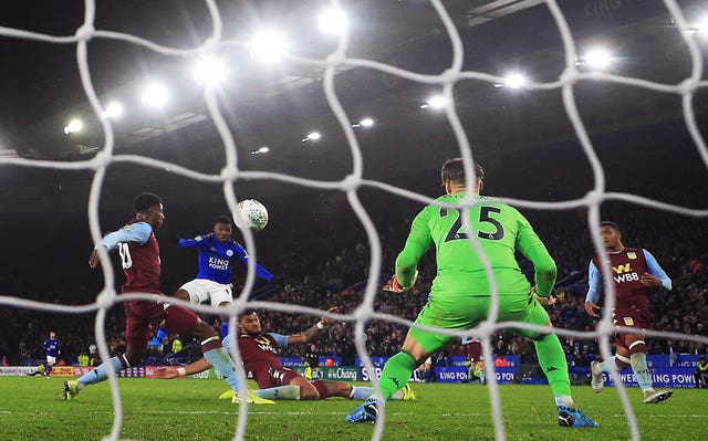 Kelechi Iheanacho, centre, scores for Leicester against Aston Villa