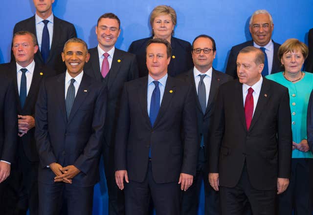 Angela Merkel and Recep Tayyip Erdogan at a Nato summit during David Cameron's premiership (Dominic Lipinski/PA)