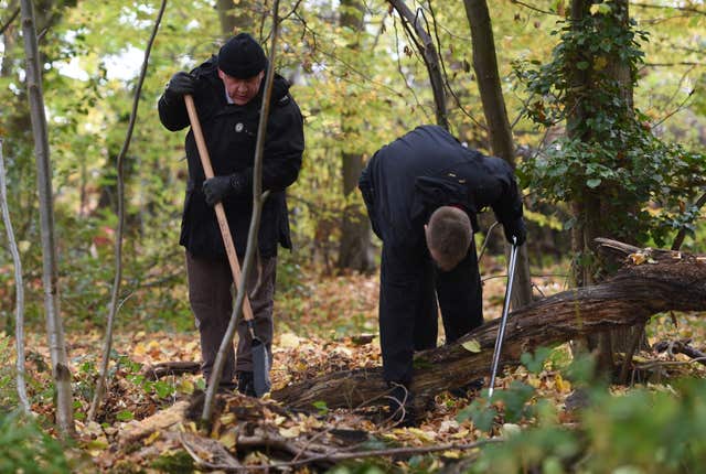 Police officers search an area of Coombe Country Park in Coventry after receiving new witness information relating to the disappearance of Nicola Payne (Joe Giddens/PA)