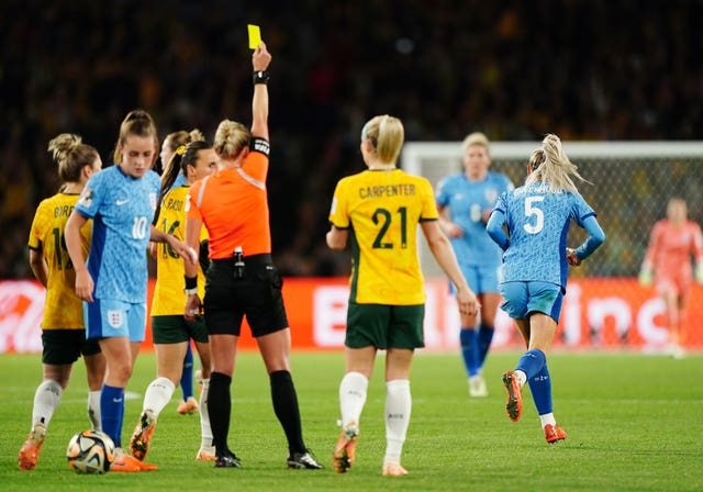 Alex Greenwood is shown an early yellow card