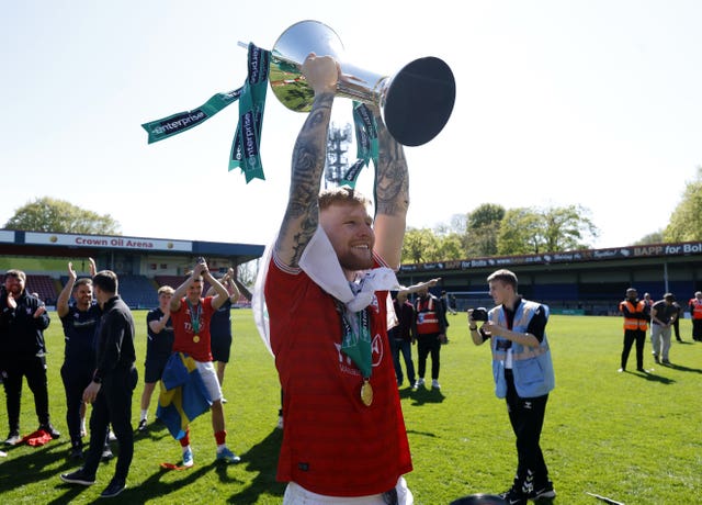 Josh Stones lifts the National League trophy