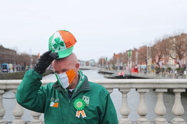 A man on O’Connell Bridge in Dublin joins in the festivities (Brian Lawless/PA)