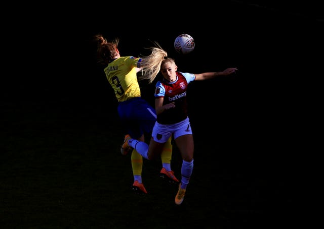Brighton's Felicity Gibbons, left, and Alisha Lehmann of West Ham compete for a header during a Women's Super League match in November. Rianna Jarrett's second-half finish earned a 1-0 away win for Albion at Chigwell Construction Stadium in Dagenham